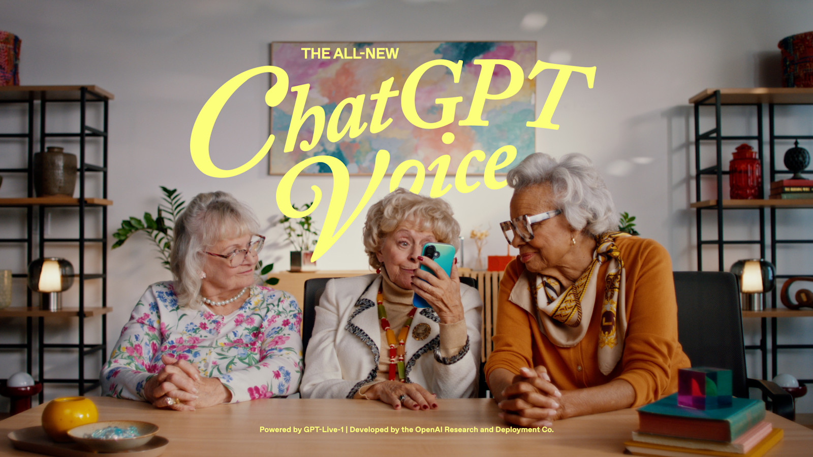 OpenAI’s ChatGPT Voice launch photo shows three women sharing a phone, with the labels The all-new ChatGPT Voice and Powered by GPT-Live-1.